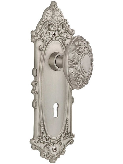 Largo Door Set with Decorative Oval Knobs and Keyhole Single Dummy in Satin Nickel.